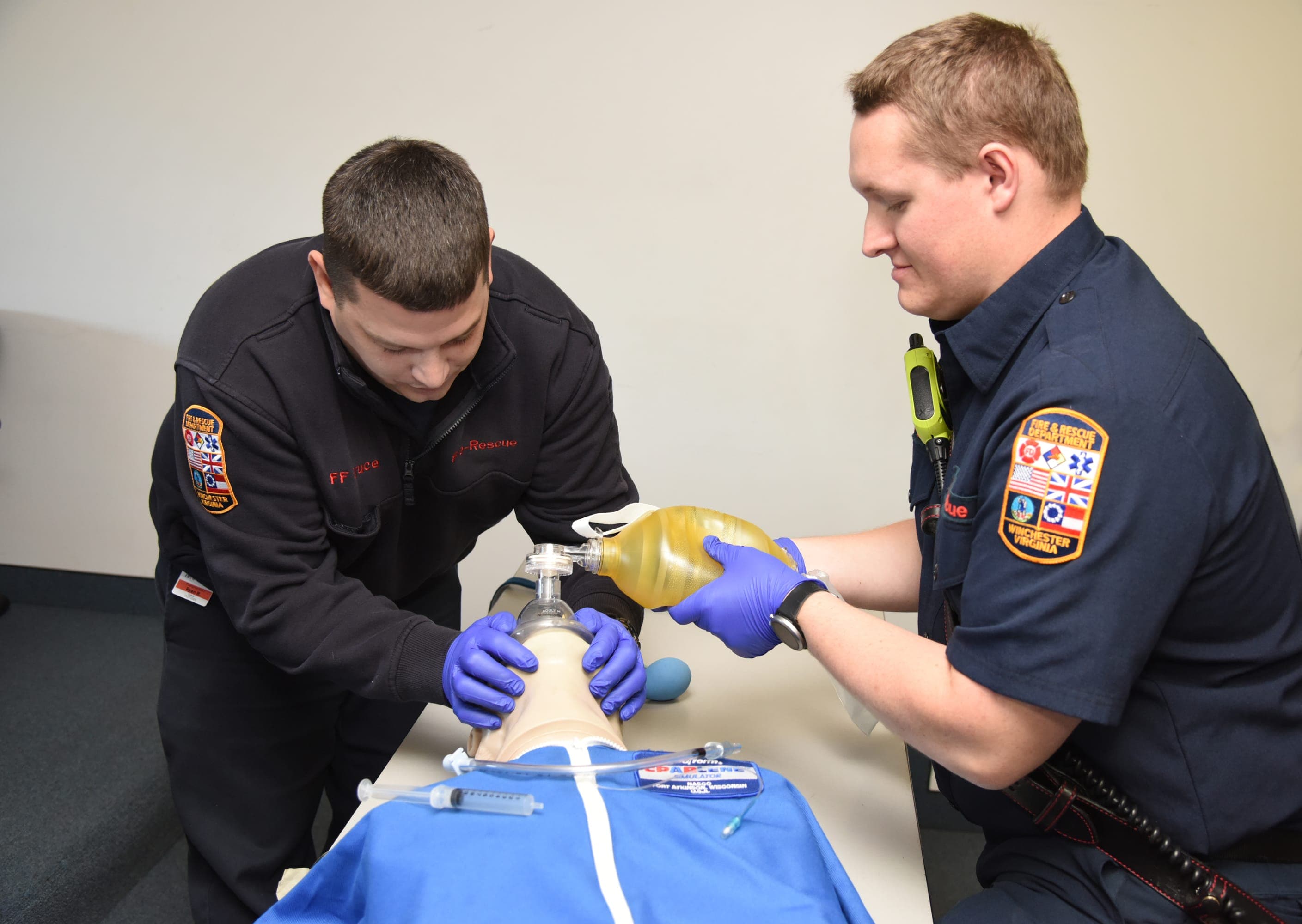 EMTs practicing resuscitation techniques